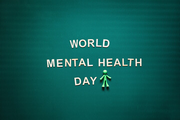 World Mental health day every year on October 10. World Mental Health Day Green Background with wooden words. A mental illness awareness