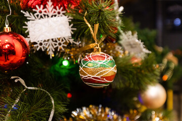 Close up of balls on christmas tree. background New Year concept.