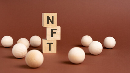 wooden cubes block with alphabet combine abbreviation NFT.
