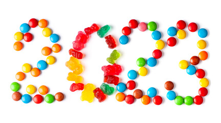 Mixed colorful candies. New year 2023 made of color sweets on white background. Top view