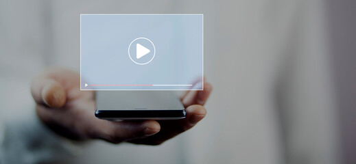 Man using a smartphone, watching video on the internet