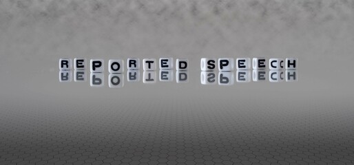 reported speech word or concept represented by black and white letter cubes on a grey horizon background stretching to infinity