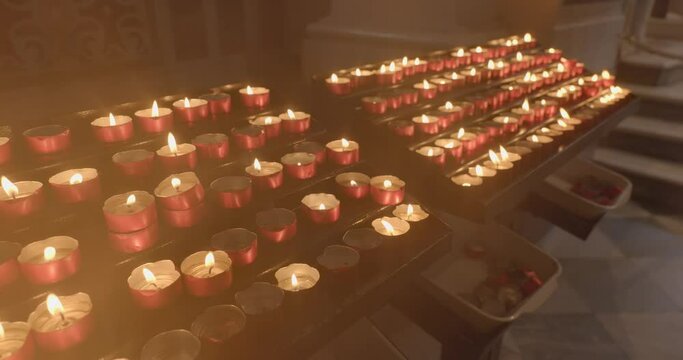 Still video of many candles in the church