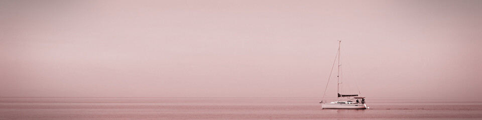 Universal banner 4x1 for websites, social networks and typography boat on the quiet surface of the sea at sunset