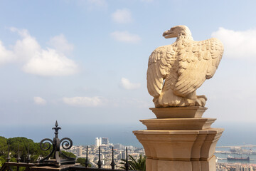 Fototapeta premium Haifa, Israel, August 12, 2022 : A decorative eagle statue is in the Bahai Garden, located on Mount Carmel in the city of Haifa, in northern Israel