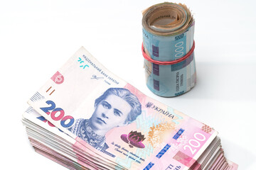 heap of different Ukrainian hryvnia in isolated background