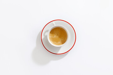 Espresso in white ceramic cup on white background