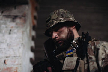 Portrait of a Ukrainian soldier in his combat position.