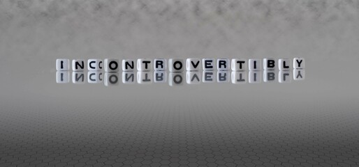 incontrovertibly word or concept represented by black and white letter cubes on a grey horizon background stretching to infinity - obrazy, fototapety, plakaty