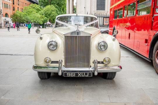 London, UK - August 21, 2022: Rolls-Royce classic car decorated for a wedding outside St Pauls Cathedral in London.