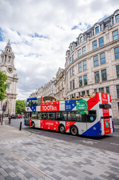 London, UK - August 21, 2022: Toot Bus, London touring bus outside St Pauls Cathedral in London.