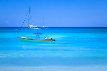 Tropical idyllic caribbean beach with sailboats, Punta Cana, Dominican Republic