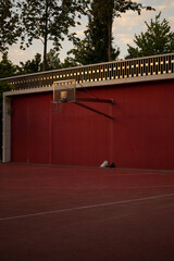 red wall with basketball rings