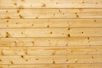 Wood texture background. The texture of the wall is covered with wood. Treated tree. Repairs. Frame construction material. Thin covering board. Lining. Natural wood.