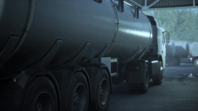 large white cistern trucks in a factory