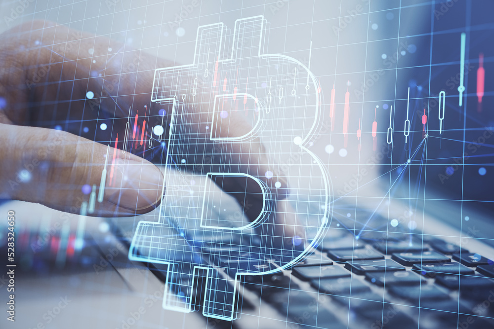 Poster Close up of hand using laptop with glowing digital bitcoin hologram and lines on blurry background. Cryptocurrency, online banking, app and finance concept. Double exposure.