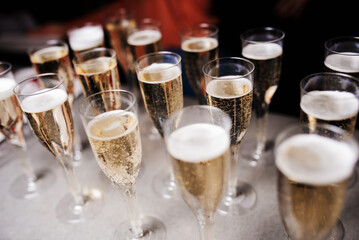 Champagne glasses on gold background. Party and holiday celebration concept