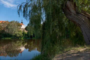 Fototapeta na wymiar Sunny royal medieval Town Pisek above the River Otava, Czech Republic 