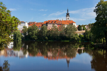Fototapeta na wymiar Sunny royal medieval Town Pisek above the River Otava, Czech Republic 