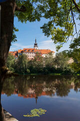 Fototapeta premium Sunny royal medieval Town Pisek above the River Otava, Czech Republic 