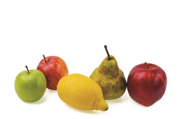 Close up view of diet fresh fruits of apples, lemon, and pear isolated on white background.