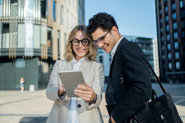 A business woman and a man communicate about the work of a colleague, go to work in a new office.