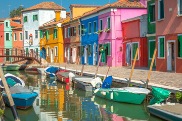 Fototapeta na wymiar Burano island canal, colorful houses and boats, Venetian lagoon, Italy