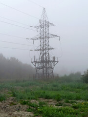 The last electric transmission tower at the edge of the forest. Electric wires do not continue further, power supply is interrupted