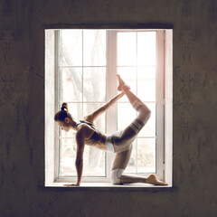 Attractive Sporty Young Caucasian Woman Doing Workout Exercise Against Window.