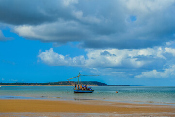 Pristine and Turquoise blue green beach under blue cloudy sky Portuguese Island in Maputo Mozambique