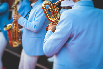 Concert view of saxophonist, a saxophone sax player with vocalist and musical band during jazz...