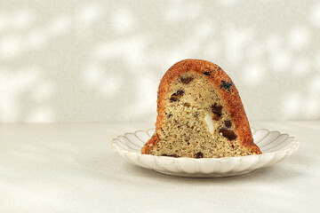 Slice of Homemade Vegan Banana Cake Baked in Bundt Pan. Concept Healthy Vegan Bakery