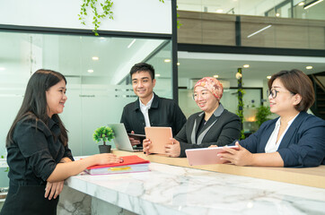 Group of office business people working together in a modern co working space.