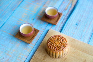 Moon cake served with chinese tea. Mid-autumn festival concept. Copy space. Top view.
