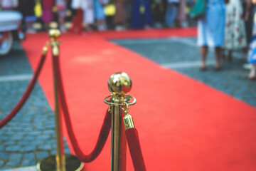 Red carpet with ropes and golden barriers on a luxury party entrance, cinema premiere film festival...