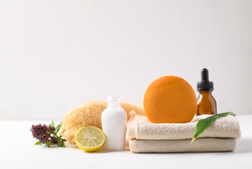 Obraz na płótnie Canvas Natural body and skin care product (soap, essential oil and treatment) on white background