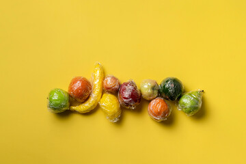 set of some fresh fruits in transparent plastic wrap