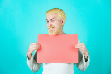 Young man holding blank sheet. Season sales.