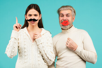 Identity transgender, gender stereotypes. Woman with moustache and man with red lips. Couple gender...