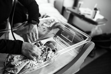 Newborn baby in the hospital getting vitals taken