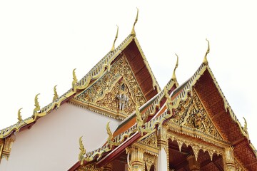 Thai art rooftop of Wat Suthat Thepwararam. It is a royal temple of the first grade, one of ten such temples in Bangkok, THAILAND.