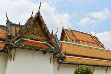 Thai art rooftop of Wat Suthat Thepwararam. It is a royal temple of the first grade, one of ten such temples in Bangkok, THAILAND.