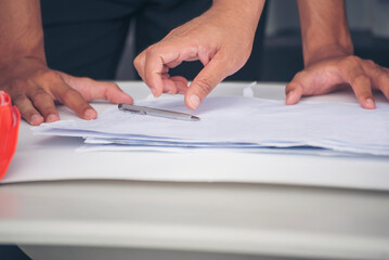 Civil Construction engineer teams shaking hands together wear work helmets worker on construction site. Foreman industry project working engineer teamwork. Two asian engineer team shake hands together