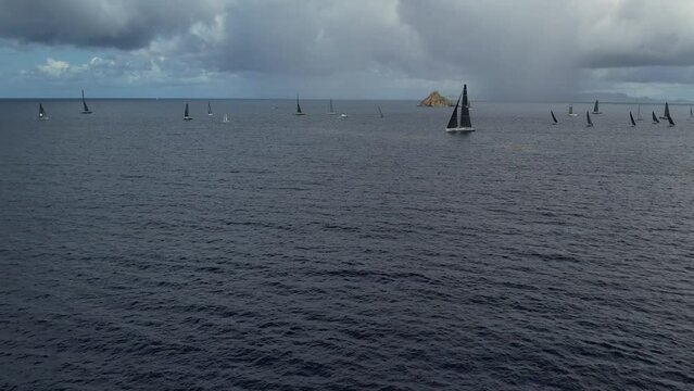 Saint Barthelemy, Gustavia Regatta Sailboats racing in the sea with clear skies and calm waters near the coast with islands around beautiful and scenic 