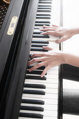 Piano player. Pianist hands playing grand piano keys