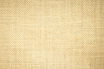 Jute hessian sackcloth burlap woven, linen texture pattern background in light beige cream brown color.