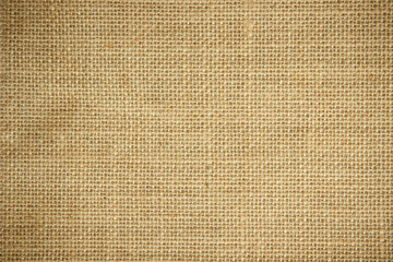 Fototapeta na wymiar Jute hessian sackcloth burlap woven, linen texture pattern background in light beige cream brown color.