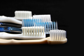 A toothbrush is an oral hygiene tool used to clean the teeth, gums, and tongue. It consists of a head of tightly clustered bristles