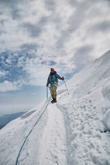 Climbing Kazbek, Georgia. male climber go to the summit.  Nature of Caucasian mountains. Mount...