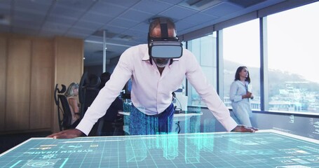 Animation of a businessman wearing a VR headset with a 3d plan on a table - Powered by Adobe